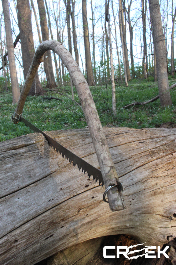 bow-saw-in-log