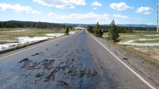 This undated photo provided by the National Park Service shows damage to a Yellowstone National Park road caused by the park???s ever-changing thermal features in the park in Wyoming. The hot, damaged pavement has prompted park officials to close Firehole Lake Drive and access to some geysers and thermal features at the height of summer tourist season. (AP Photo/Yellowstone National Park)